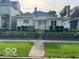Charming one-story home featuring a landscaped yard and inviting front porch at 2830 Guilford Ave, Indianapolis, IN 46205