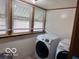 Laundry room featuring Samsung washing machine and dryer with window for natural light at 2830 Guilford Ave, Indianapolis, IN 46205