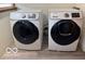 Laundry room featuring Samsung washing machine and dryer on wood look vinyl flooring at 2830 Guilford Ave, Indianapolis, IN 46205