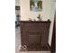 A brick fireplace with decorative artwork offers charm to the living area at 2830 Guilford Ave, Indianapolis, IN 46205