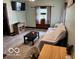 Comfortable living room featuring a couch, coffee table, and natural light at 2830 Guilford Ave, Indianapolis, IN 46205