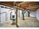 Spacious unfinished basement with exposed piping, utilities and open ceiling at 3210 Hovey St, Indianapolis, IN 46218