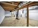 Unfinished basement displaying the utilities, open ceiling and concrete floor at 3210 Hovey St, Indianapolis, IN 46218