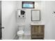 Stylish bathroom featuring a modern vanity, elegant fixtures, and a well-lit mirror, creating a spa-like retreat at 3210 Hovey St, Indianapolis, IN 46218