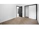 Bright bedroom featuring plush carpet, ample closet space, and neutral paint, creating a serene and comfortable living space at 3210 Hovey St, Indianapolis, IN 46218