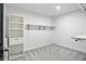 Spacious walk-in closet with custom shelving and hanging racks, perfect for organized storage solutions at 3210 Hovey St, Indianapolis, IN 46218