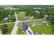 Expansive aerial view showcasing the property's lush landscaping and secluded location amidst mature trees at 3306 Mullinix Rd, Greenwood, IN 46143