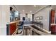 Cozy bar area with seating, dark cabinets, and views of the staircase and living room at 3306 Mullinix Rd, Greenwood, IN 46143