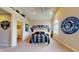 Large bedroom with vaulted ceilings, unique cat-themed wall art, and plenty of natural light at 3306 Mullinix Rd, Greenwood, IN 46143