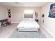 Bedroom featuring a bed with a tufted headboard, a desk, and neutral walls at 3306 Mullinix Rd, Greenwood, IN 46143