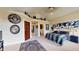 Large bedroom with unique wall art and an ensuite bathroom at 3306 Mullinix Rd, Greenwood, IN 46143