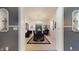 Elegant dining room with chandelier, large table, and modern art at 3306 Mullinix Rd, Greenwood, IN 46143