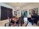 Dining room featuring a chandelier, modern art, and an adjacent sitting area at 3306 Mullinix Rd, Greenwood, IN 46143