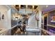 Elegant foyer with a curved staircase, gleaming floors, and soaring ceilings creating a grand entrance at 3306 Mullinix Rd, Greenwood, IN 46143