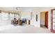 Bright game room includes a built-in bar, ample seating, and natural light for entertainment and relaxation at 3306 Mullinix Rd, Greenwood, IN 46143