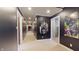 View of the hallway featuring unique paintings, dark walls, and white trim at 3306 Mullinix Rd, Greenwood, IN 46143