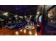 A luxurious home theater features plush seating, a large screen, and ambient lighting for an immersive viewing experience at 3306 Mullinix Rd, Greenwood, IN 46143