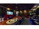 A luxurious home theater features plush seating, a large screen, and ambient lighting for an immersive viewing experience at 3306 Mullinix Rd, Greenwood, IN 46143