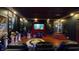 Home theater with large screen and reclining seats provides an immersive viewing experience, perfect for movie nights at 3306 Mullinix Rd, Greenwood, IN 46143