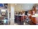 Spacious kitchen with an island, stainless appliances, marble countertops, and dark cabinets at 3306 Mullinix Rd, Greenwood, IN 46143
