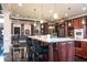 Gourmet kitchen with a large island, granite countertops, and stainless steel appliances, perfect for culinary enthusiasts at 3306 Mullinix Rd, Greenwood, IN 46143