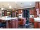 Gourmet kitchen with a large island, granite countertops, and stainless steel appliances, perfect for culinary enthusiasts at 3306 Mullinix Rd, Greenwood, IN 46143