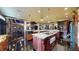 A spacious kitchen features two islands with granite counters, modern appliances, and pendant lighting at 3306 Mullinix Rd, Greenwood, IN 46143