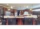 Kitchen features granite countertops, stainless appliances, dark cabinets, and bar seating at 3306 Mullinix Rd, Greenwood, IN 46143