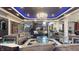 Spacious living room with designer furnishings, blue ambient lighting and open layout, perfect for entertaining at 3306 Mullinix Rd, Greenwood, IN 46143