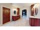 This bathroom provides ensuite access, double vanities, and tiled flooring at 3306 Mullinix Rd, Greenwood, IN 46143