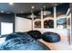 A media room featuring a dark ceiling and multiple comfortable black bean bag chairs at 3306 Mullinix Rd, Greenwood, IN 46143