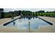 Inviting in-ground pool with a concrete surround, perfect for relaxing and entertaining at 3306 Mullinix Rd, Greenwood, IN 46143