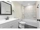 Bathroom featuring a tub with a shower, a vanity with a mirror, and black fixtures at 3562 E Morris St, Indianapolis, IN 46203