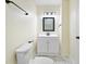 Bathroom with white fixtures, grey flooring, and black accents at 3562 E Morris St, Indianapolis, IN 46203