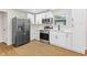 Modern kitchen featuring stainless steel appliances, white cabinets, and marble countertops at 3562 E Morris St, Indianapolis, IN 46203