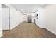 Open-concept kitchen and living area with sleek appliances and hardwood floors at 3562 E Morris St, Indianapolis, IN 46203