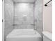 Bathroom shower with tiled wall and corner glass shelves at 3562 E Morris St, Indianapolis, IN 46203