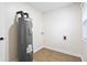 Small utility room with vinyl flooring, and water heater at 3562 E Morris St, Indianapolis, IN 46203