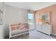 Well-lit bedroom featuring board and batten wall, stylish dresser, and a large window with neighborhood views at 3610 Duncan Ct, Whitestown, IN 46075