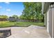 Spacious backyard with concrete patio, lush lawn, a wooden shed, and privacy fence at 3931 Tekesbury Ct, Plainfield, IN 46168