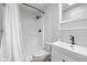 Bright bathroom featuring a shower over the toilet and a pedestal sink and vanity at 3931 Tekesbury Ct, Plainfield, IN 46168