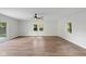 Bright, airy bedroom features a ceiling fan, three windows and a sliding glass door at 3931 Tekesbury Ct, Plainfield, IN 46168
