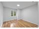 Bright bedroom features wood-look floors and a large window, providing natural light and a serene view at 3931 Tekesbury Ct, Plainfield, IN 46168
