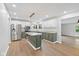 Modern kitchen with stainless steel appliances, granite countertops, and a central island at 3931 Tekesbury Ct, Plainfield, IN 46168