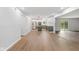 Open-concept living space featuring a modern kitchen, flowing into the living room, and a sliding door at 3931 Tekesbury Ct, Plainfield, IN 46168