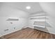 A storage room with luxury vinyl flooring and wire shelving installed along the back wall at 3931 Tekesbury Ct, Plainfield, IN 46168