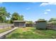 Spacious yard features two sheds and a fence line, offering ample storage and privacy at 3931 Tekesbury Ct, Plainfield, IN 46168