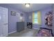 Charming bedroom with soft purple walls, cozy carpet, and whimsical decor, creating a playful and inviting space at 408 Ottawa Dr, Indianapolis, IN 46217