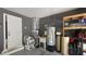 Utility area in garage with water heater, sink, and additional storage space at 408 Ottawa Dr, Indianapolis, IN 46217