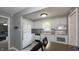 Bright kitchen features updated appliances, stylish backsplash, and adjacent dining area at 408 Ottawa Dr, Indianapolis, IN 46217